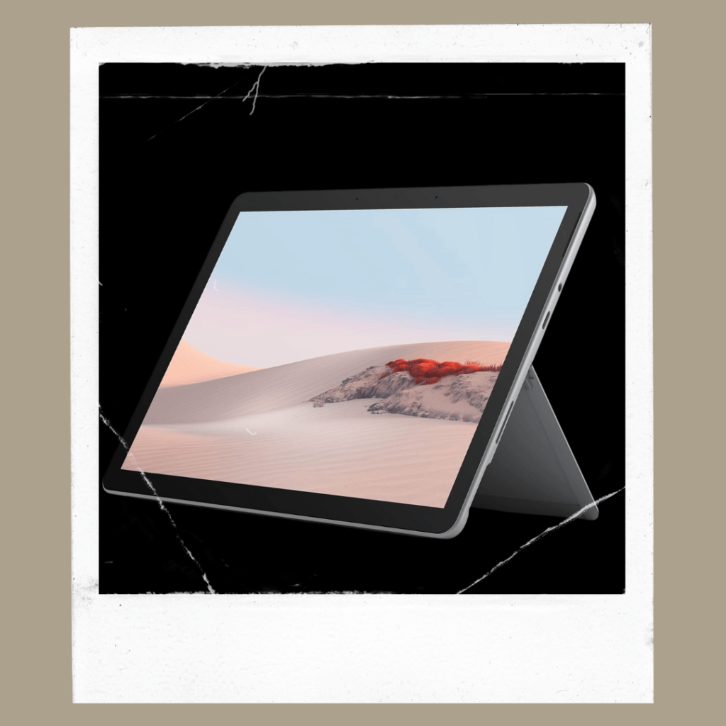 Compact tablet-style laptop on a stand with minimal workspace aesthetic