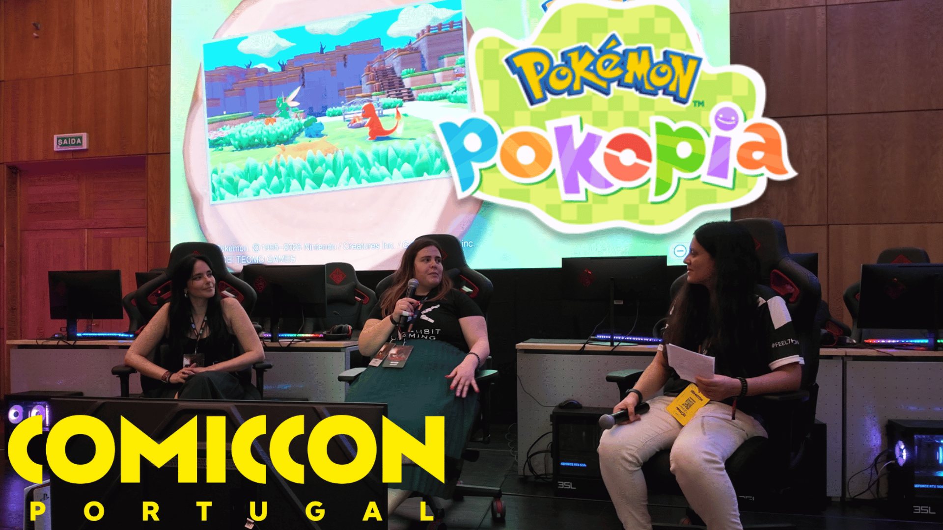 Three panelists on stage at the Pokémon Pokopia panel during Comic Con Portugal 2026, with the Comic Con and Pokopia logos visible.